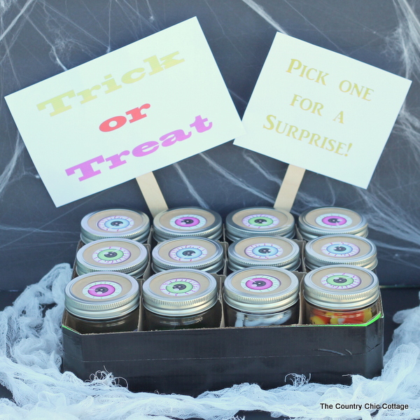 Trick or Treat Halloween Party Game -- let each person choose a jar for a trick or a treat. The trick is they are all tricks that are treats! Click to see!