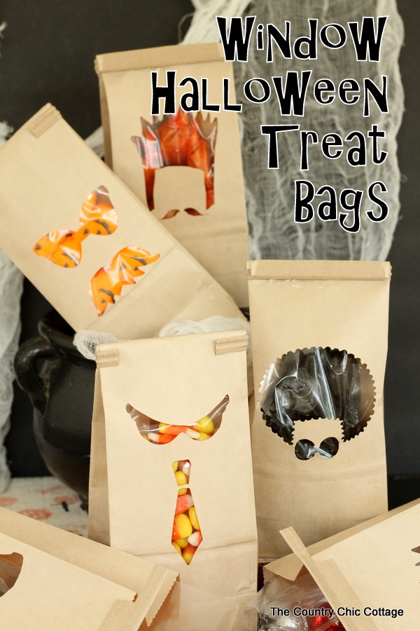 Window Halloween Treat Bags -- cut a few window in pre-made bags for Halloween treats that look amazing!