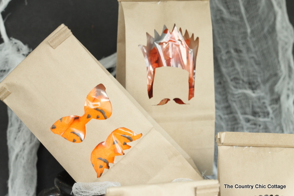 halloween paper bags with candy treats inside