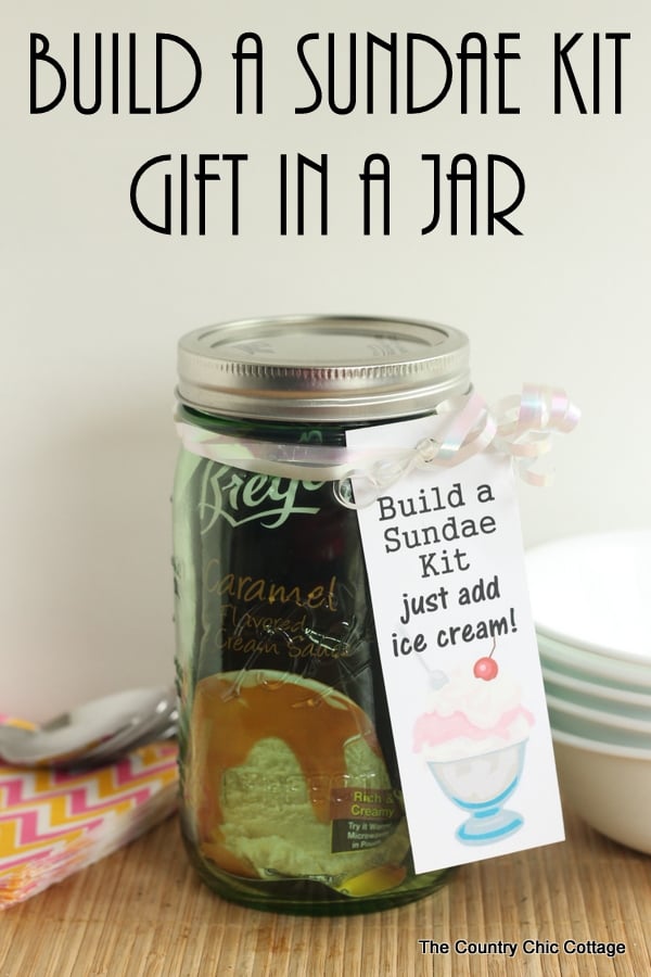 Build a Sundae Kit Gift in a Jar -- fill a mason jar with everything needed for a sundae but ice cream. Includes free printable tags!
