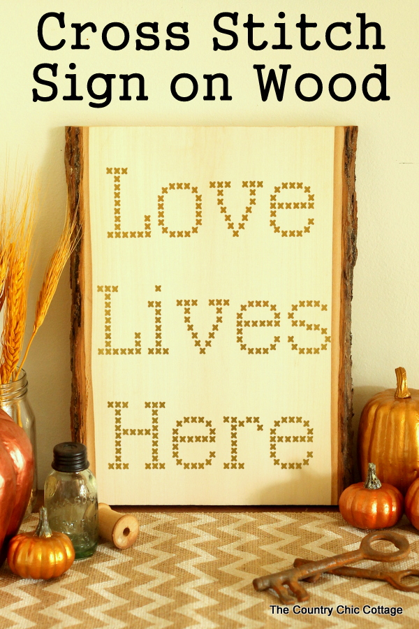 Make your own cross stitch sign on wood using vinyl and your Cricut Explore.