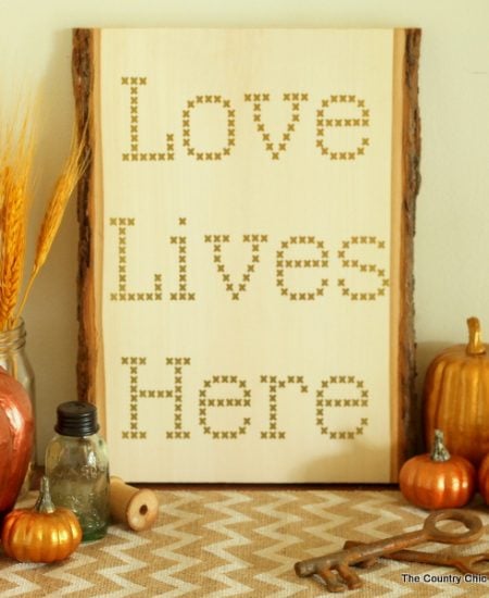 Make your own cross stitch sign on wood using vinyl and your Cricut Explore.