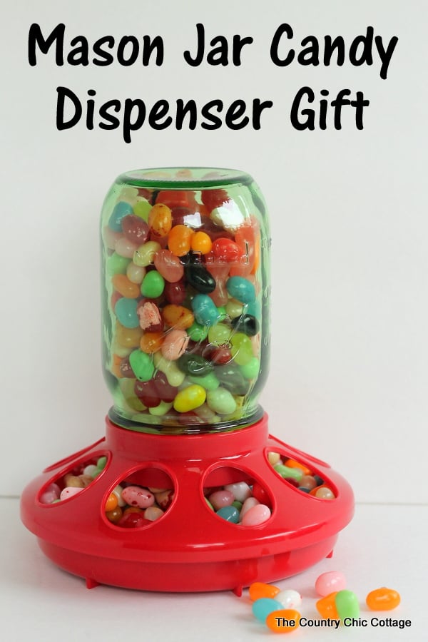 Mason Jar candy dispenser with overlay saying "mason jar candy dispenser gift"