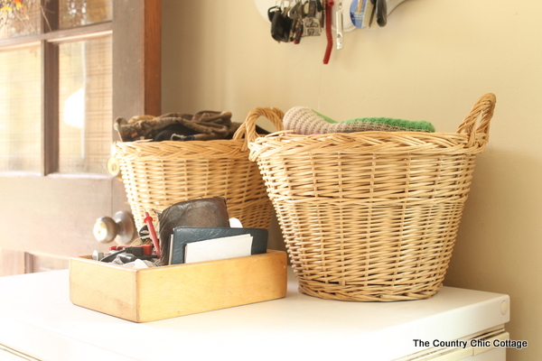 Baskets on top of a deep freezer in mudroom.