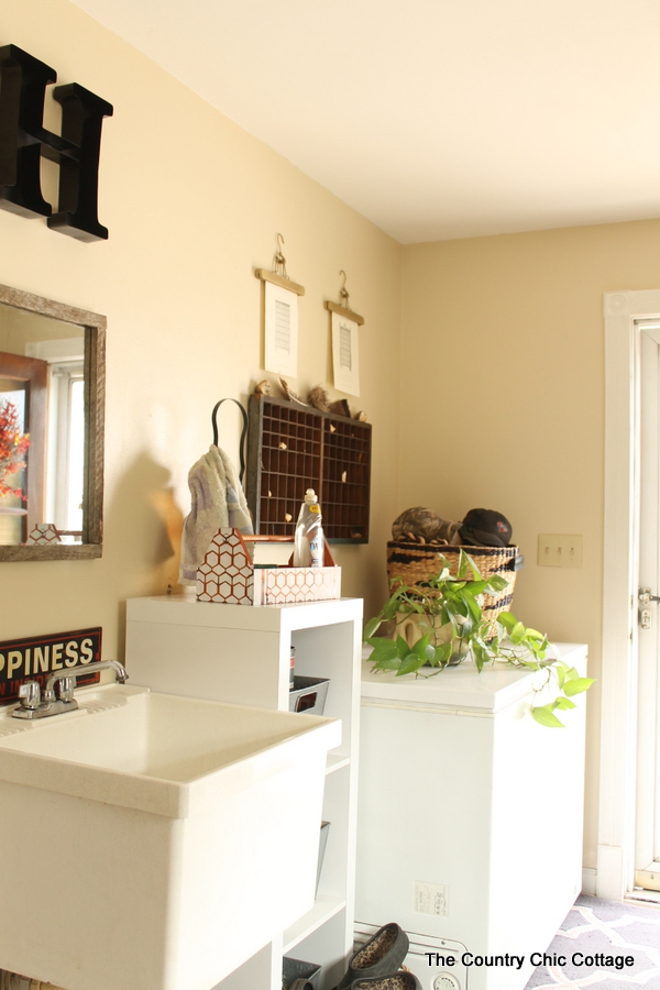 A large sink next to the freezer in mudroom.