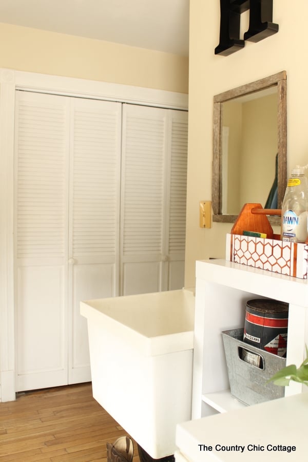 A large sink in farmhouse style mudroom.