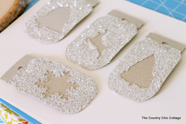 Make these glittered mason jar ornaments easily with a Cricut Explore. Click here to learn how!