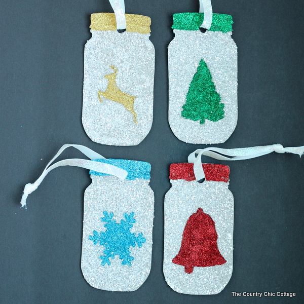 Make these glittered mason jar ornaments easily with a Cricut Explore. Click here to learn how!