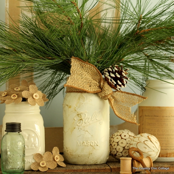 gold marbled mason jar displayed with other white mason jars