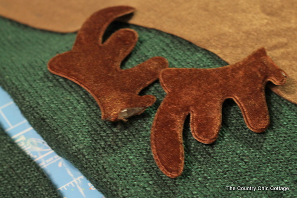 closeup of antlers being added to a DIY ugly sweater
