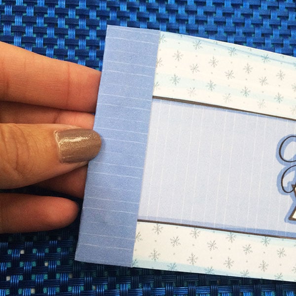 Add patterned paper with glue to cover staples.