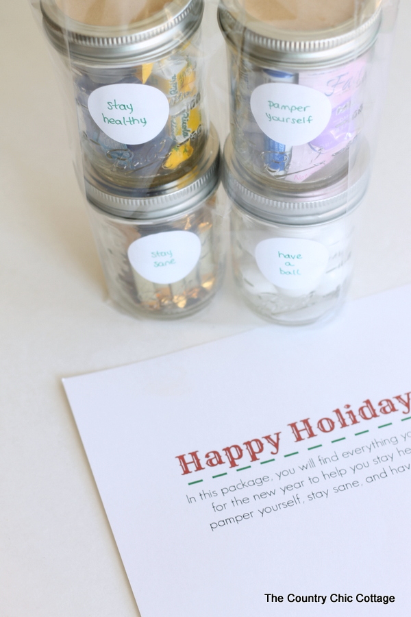 A fun stacked gift in a jar with a free printable topper. Give them everything they need to start the new year off right!