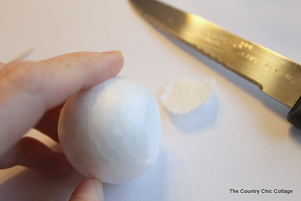 cutting off the bottom of a foam ball to make it flat