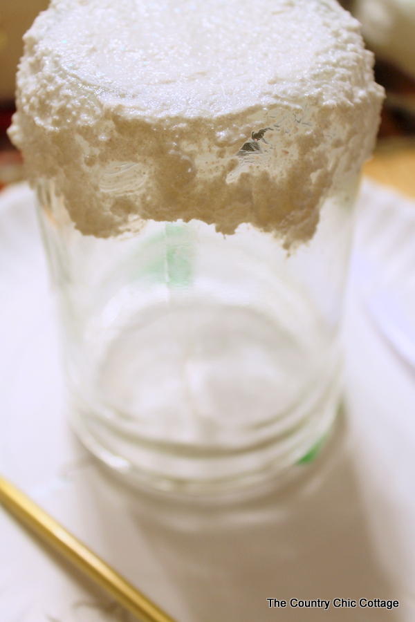 painting "snow" on a mason jar