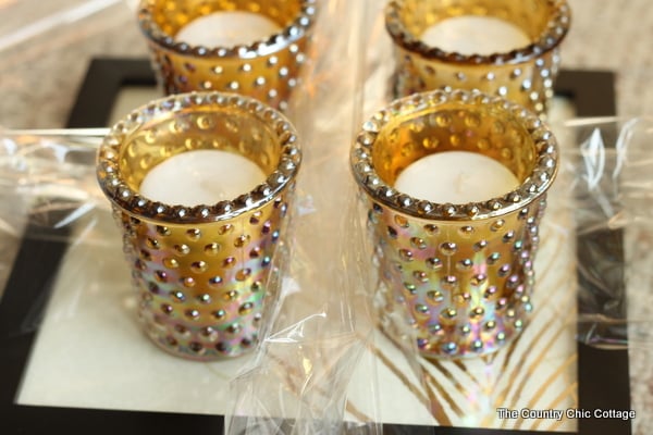 Put the votives in the candle holders and arrange them on the tray for an easy, affordable gift