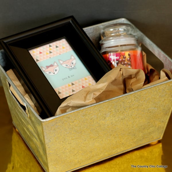 Make this cute gift basket idea for less than $20! A simple candle and picture frame is perfect for the friend who loves home decor