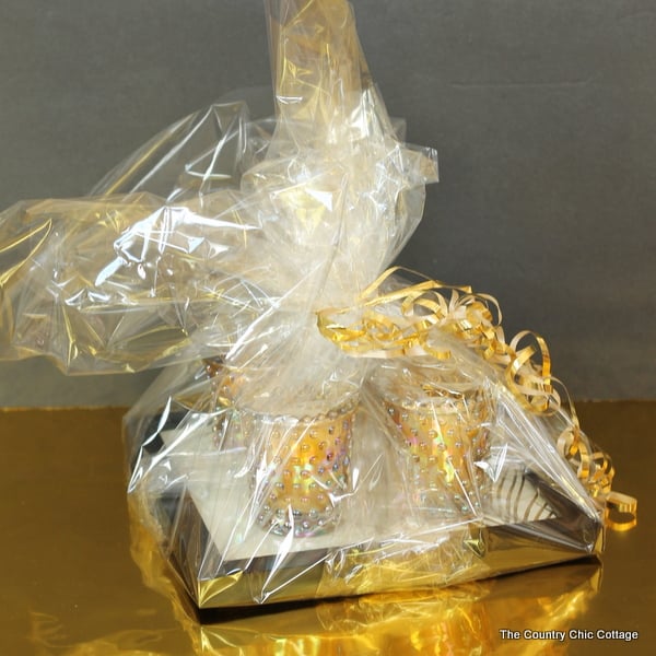 Wrap the candle tray with clear gift wrap and tie with a ribbon! This affordable gift idea cost less than $20