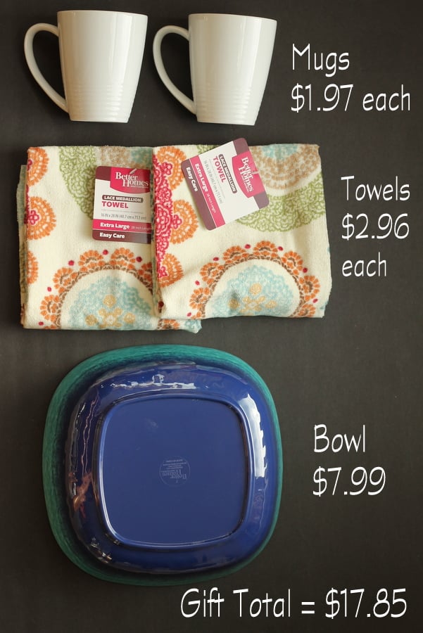 This gift idea only cost $18 and includes two coffee mugs, two tea towels, and a lovely blue serving bowl