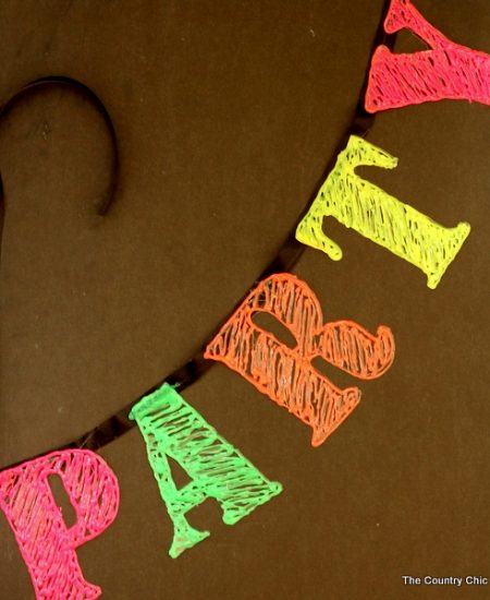 Use hot glue and a ribbon to make a party banner that will look great at a birthday party or even for New Years! Grab some neon hot glue to make this one look amazing!