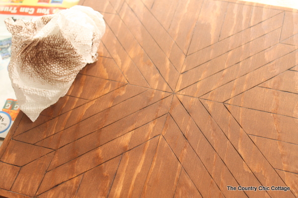 applying and wiping away the wood stain