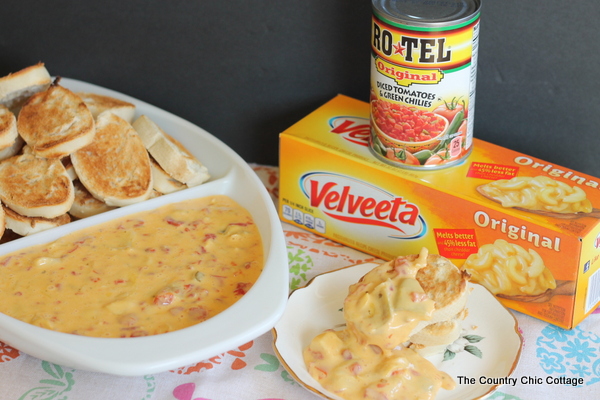 Artichoke Queso Dip Recipe -- add artichoke hearts to your favorite cheese dip for an out of this world snack idea!