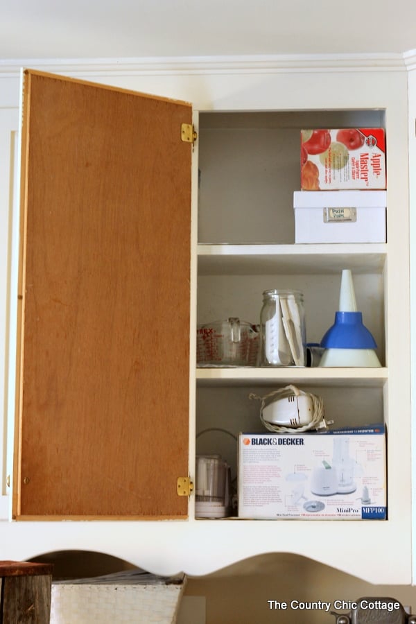 Cabinet Door Organization -- use the pack of your door to hang necessities and get organized!