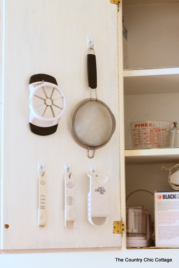 Cabinet Door Organization -- use the pack of your door to hang necessities and get organized!