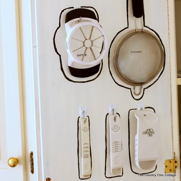 Cabinet Door Organization -- use the pack of your door to hang necessities and get organized!