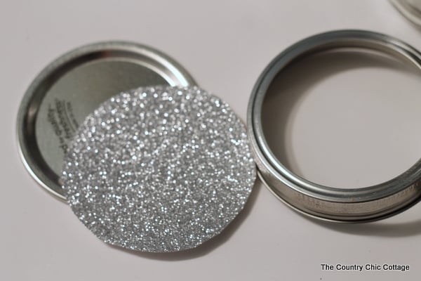 silver glitter cardstock cutout to put inside of mason jar lid.