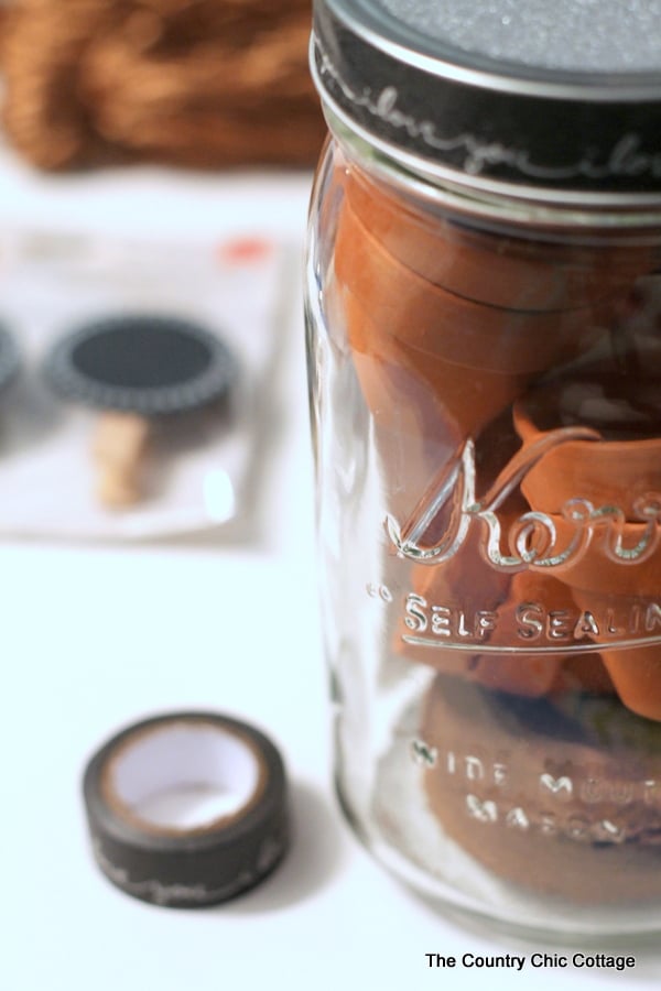 making a mini herb garden kit in a mason jar