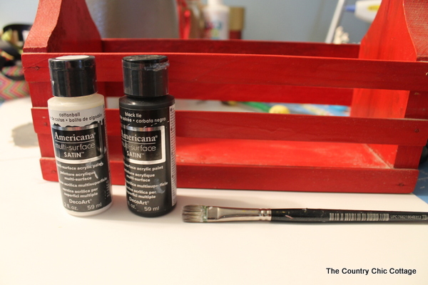 wooden crate and paint supplies for cleaning caddy