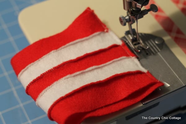 A free pattern to sew a mini Dr. Seuss hat for the top of a mason jar. Makes a great teacher gift idea!