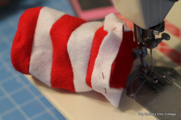 A free pattern to sew a mini Dr. Seuss hat for the top of a mason jar. Makes a great teacher gift idea!