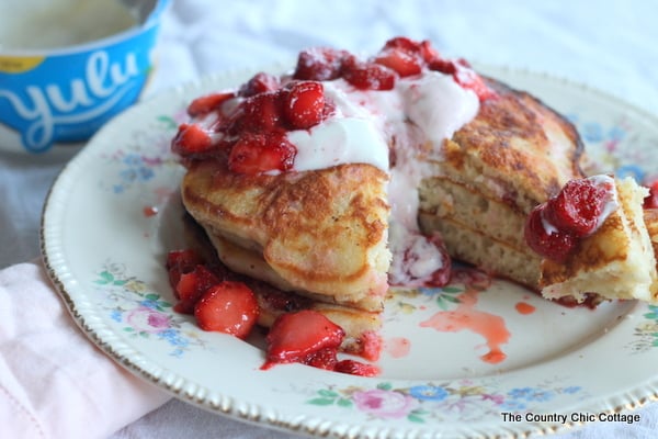 Strawberry Yogurt Pancakes -- use yogurt in and on top of your pancakes for a morning breakfast that will leave you feeling satisfied!