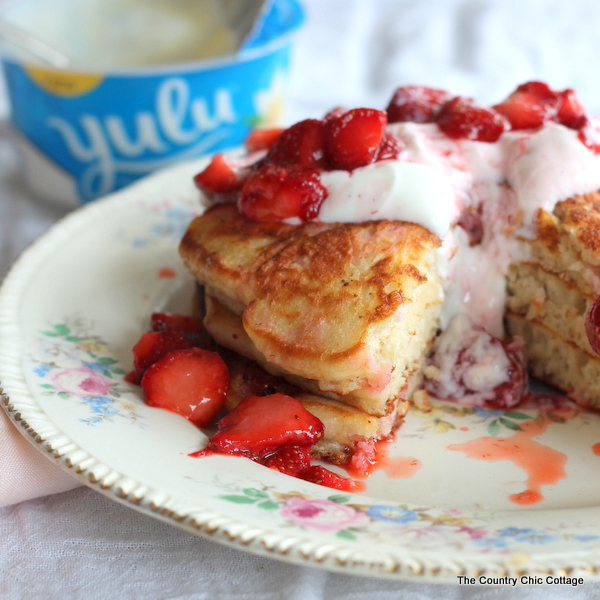 Strawberry Yogurt Pancakes -- use yogurt in and on top of your pancakes for a morning breakfast that will leave you feeling satisfied!