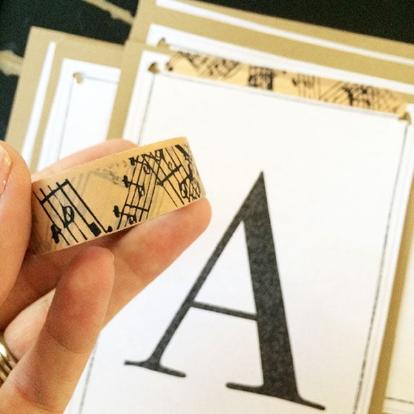 Adhere letters with washi tape to cardstock