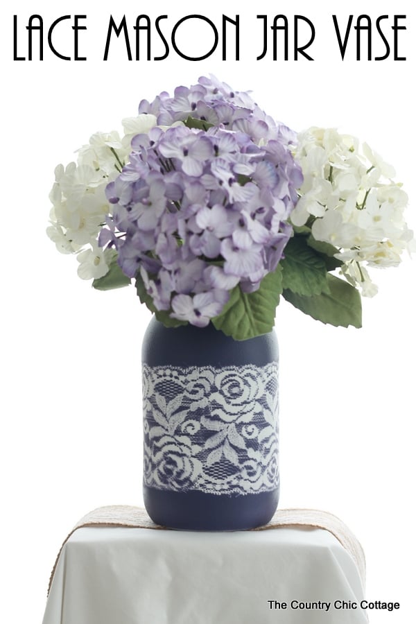 Lace Mason Jar Vase -- use two paint colors and lace as a mask to create this gorgeous painted vase for your wedding, home, or any party. Get the full step by step instructions here. Can you believe this is just paint? There is no actual lace on this jar!