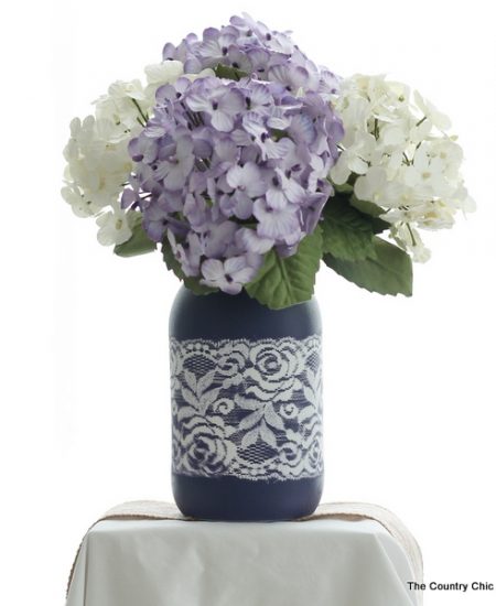 Lace Mason Jar Vase -- use two paint colors and lace as a mask to create this gorgeous painted vase for your wedding, home, or any party. Get the full step by step instructions here. Can you believe this is just paint? There is no actual lace on this jar!