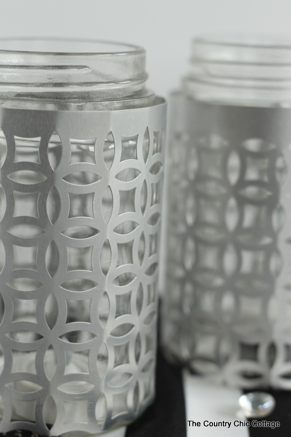 closeup of metal jar candle holders