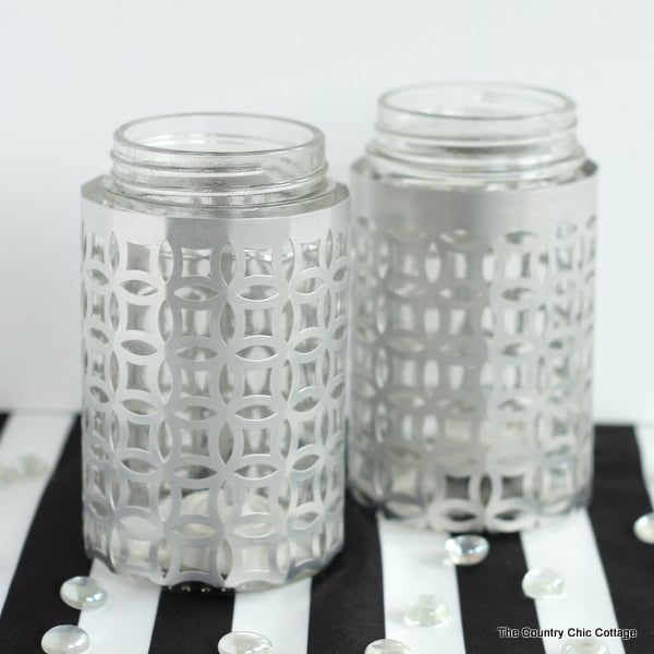 Wrap jars in metal for a gorgeous candle holder perfect for weddings or everyday use! These metal wrapped jar candle holders are so easy to make. Adding this to my must make list!