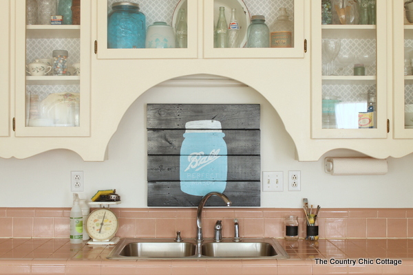 Mason jar rustic kitchen decor behind the kitchen sink