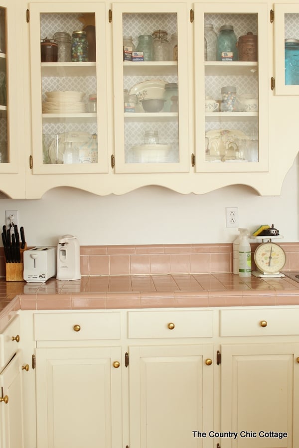 rustic kitchen decor including glass cabinet doors and mason jars