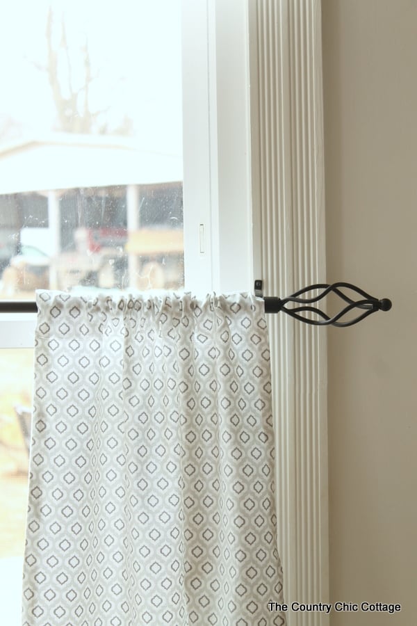 rustic curtain rod with curtain on it