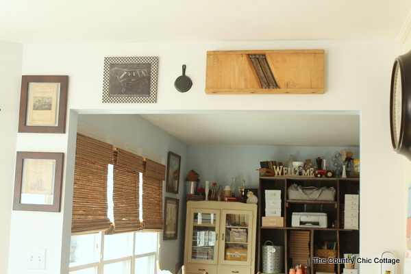 rustic and antique pieces hanging on the wall around a doorway