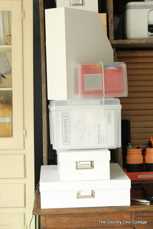 stack of organization boxes on a desk