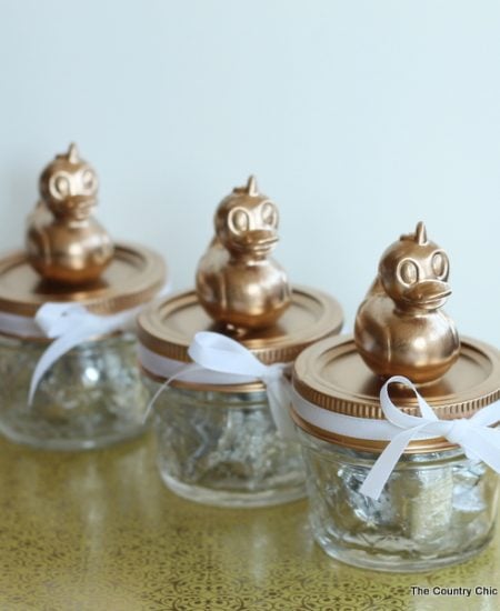 Baby shower mason jar favors -- add a simple topper to mason jars for the perfect baby shower favors in minutes!