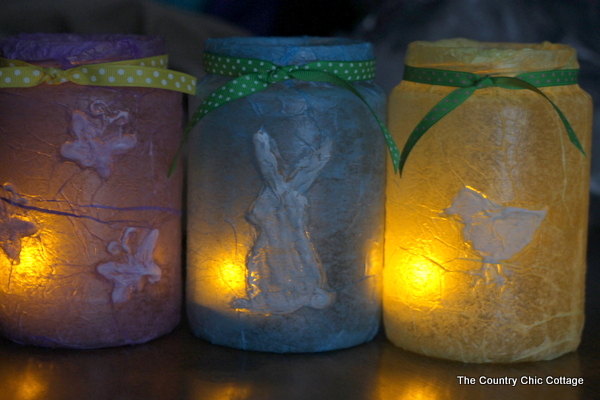 purple, blue, and yellow decoupaged jars with candles