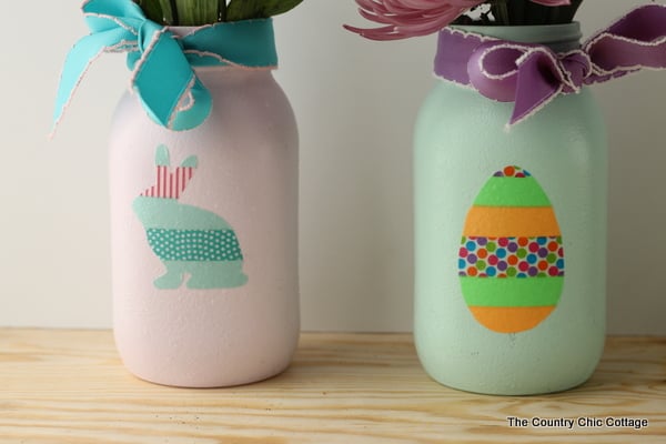 Easter mason jars -- use washi tape to make shapes that you then add to painted jars. Perfect for your Easter table!