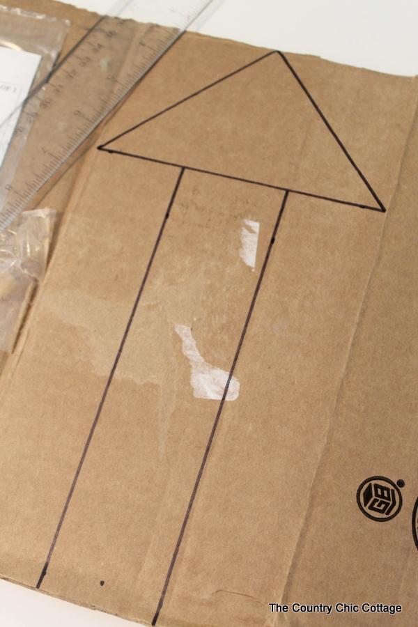 Metallic gold arrow made from cardboard boxes and Duck tape -- get the full instructions here!