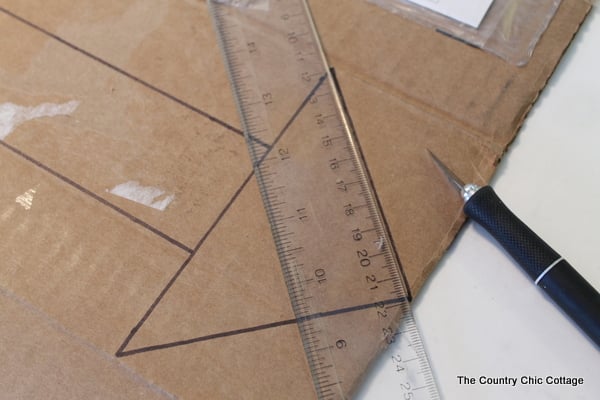 Metallic gold arrow made from cardboard boxes and Duck tape -- get the full instructions here!